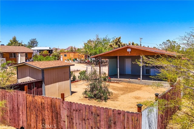 view of front of home with a patio and an outdoor structure