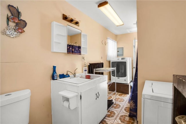 laundry room featuring separate washer and dryer, a sink, tile patterned floors, and electric panel
