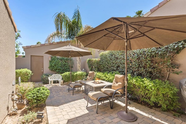 view of patio / terrace featuring a fire pit