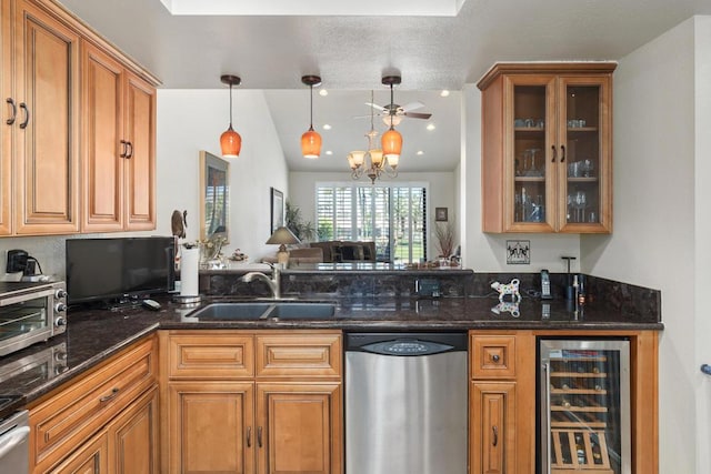 kitchen with dark stone counters, beverage cooler, sink, dishwasher, and hanging light fixtures