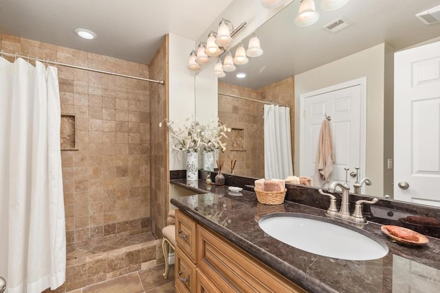 bathroom featuring vanity and walk in shower