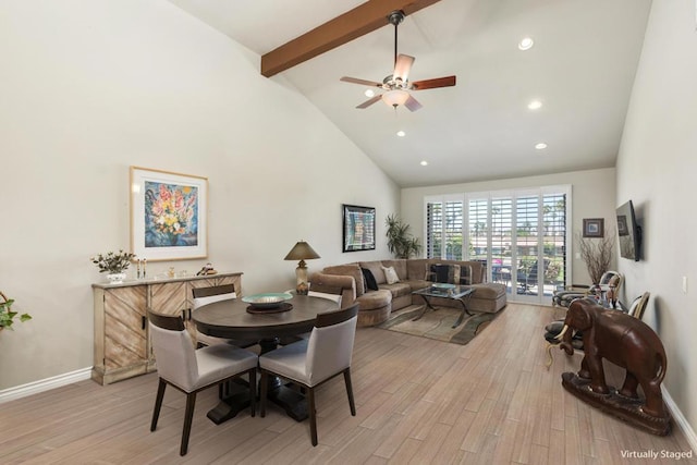 dining room featuring ceiling fan, beam ceiling, high vaulted ceiling, and light hardwood / wood-style flooring