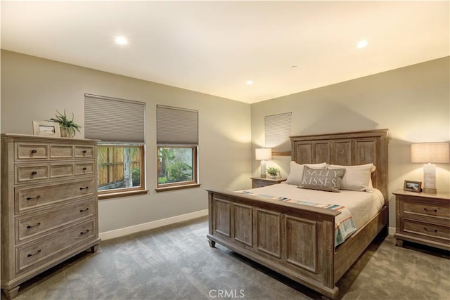 bedroom with dark colored carpet