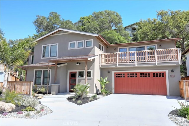 front facade featuring a balcony and a garage