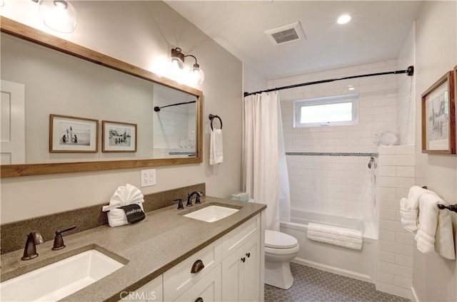 full bathroom featuring toilet, shower / bath combination with curtain, tile patterned floors, and vanity