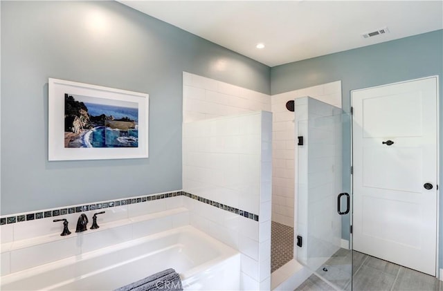 bathroom with shower with separate bathtub