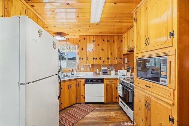 kitchen featuring dark hardwood / wood-style flooring, white appliances, wood ceiling, and sink