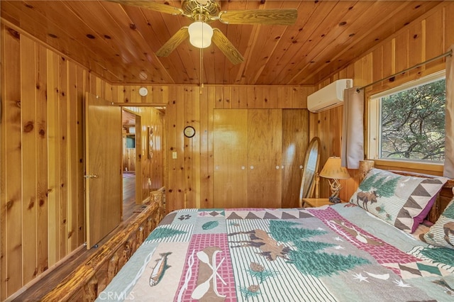 bedroom with a wall mounted air conditioner, ceiling fan, wood ceiling, and wood walls