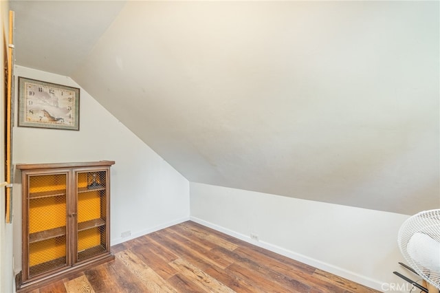 bonus room with hardwood / wood-style floors and lofted ceiling