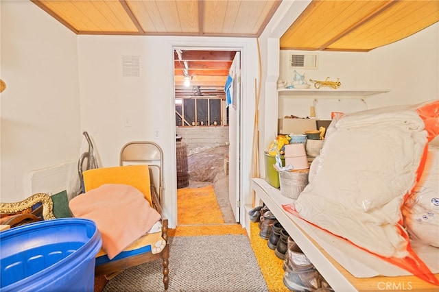 interior space with light colored carpet and wood ceiling