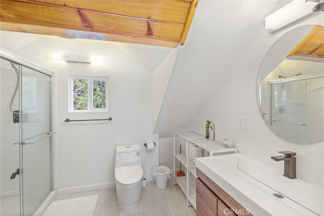 bathroom with toilet, vanity, vaulted ceiling, and a shower with door