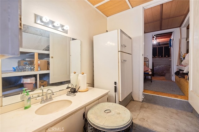 bathroom with vanity, concrete floors, and wooden ceiling