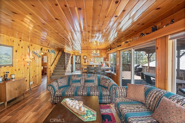 living room with hardwood / wood-style floors, lofted ceiling, wooden walls, and wood ceiling