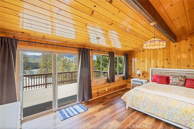 bedroom with access to exterior, hardwood / wood-style flooring, wooden ceiling, vaulted ceiling with beams, and wood walls