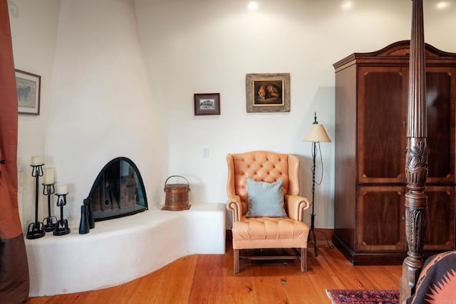 sitting room with hardwood / wood-style flooring