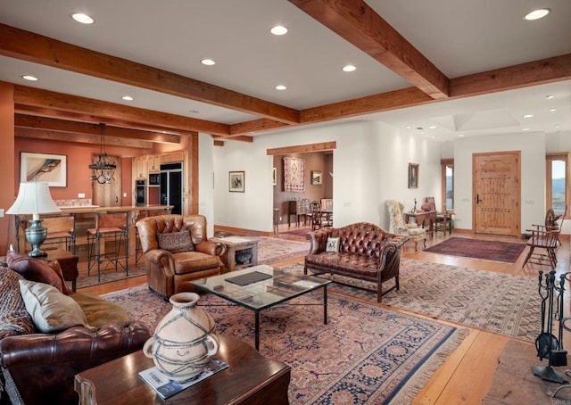 living room with wood-type flooring and beamed ceiling