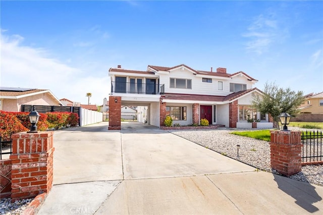 view of front property featuring a balcony