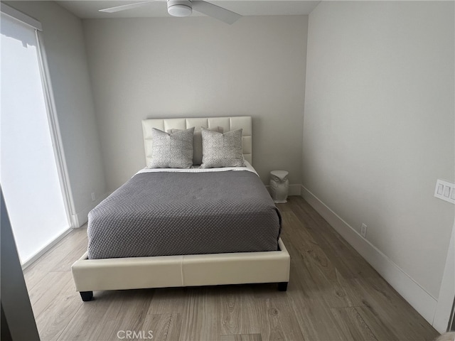 bedroom featuring ceiling fan and hardwood / wood-style floors