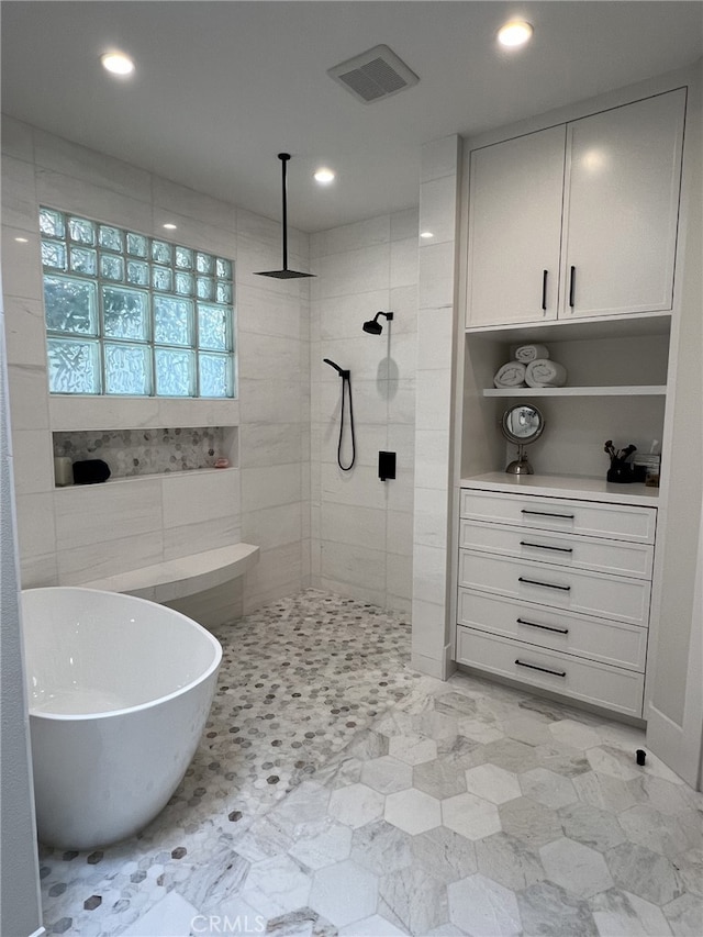 bathroom featuring plus walk in shower