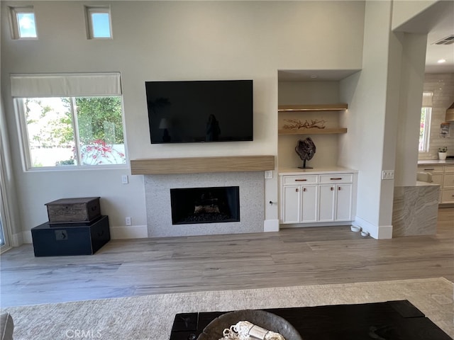 unfurnished living room featuring light hardwood / wood-style floors