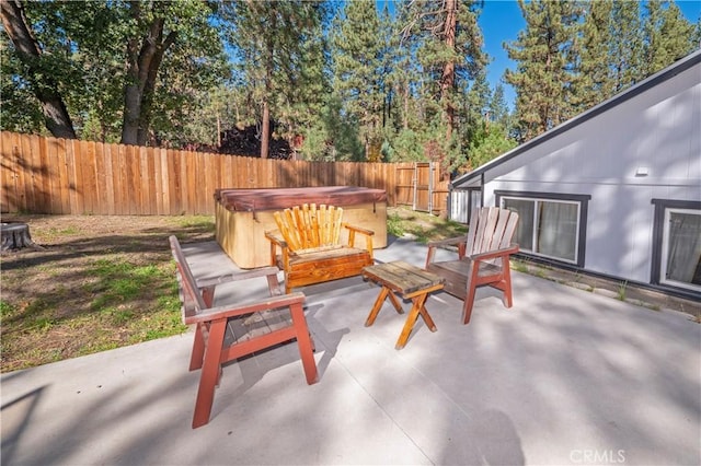 view of patio / terrace with a hot tub