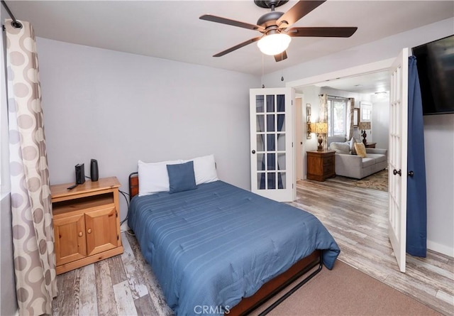 bedroom featuring hardwood / wood-style floors and ceiling fan