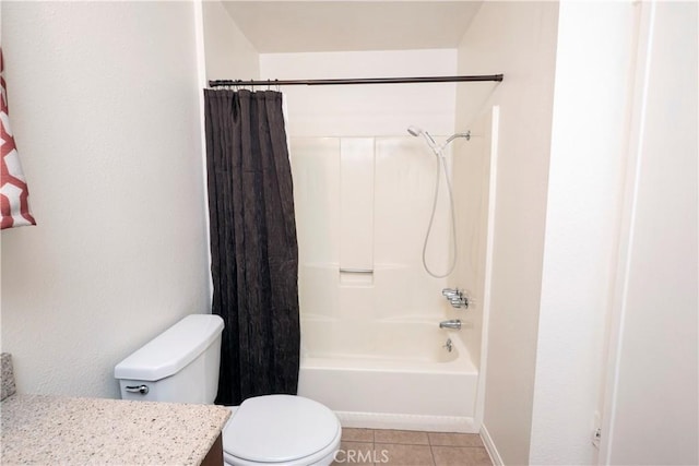 full bathroom with tile patterned floors, vanity, shower / tub combo, and toilet