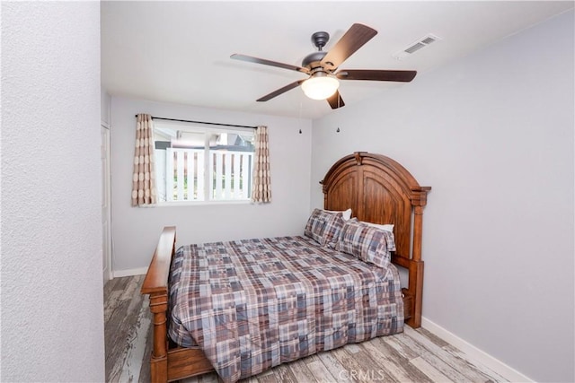 bedroom featuring ceiling fan and light wood-type flooring