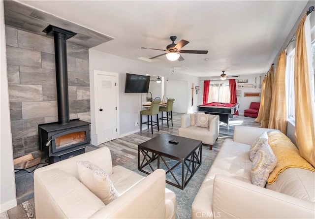 living room with light hardwood / wood-style floors and ceiling fan