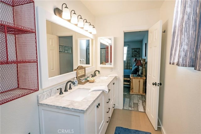 bathroom featuring vanity and wood-type flooring