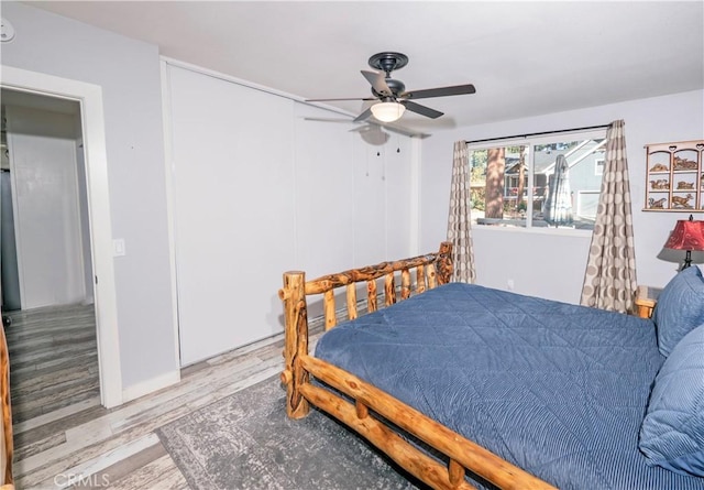 bedroom with ceiling fan and light hardwood / wood-style flooring