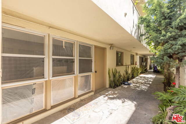 view of side of home featuring a patio area