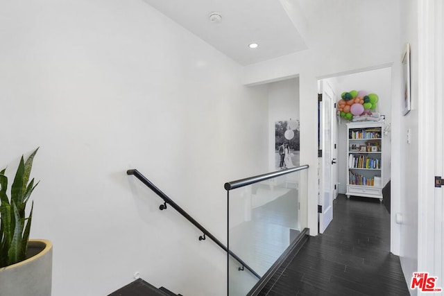 stairs with hardwood / wood-style flooring