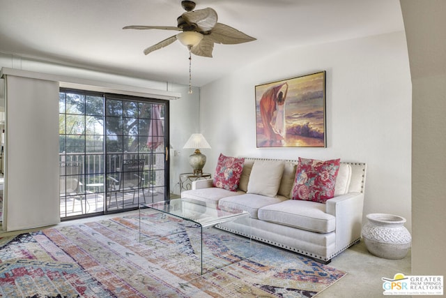 living room with carpet and ceiling fan