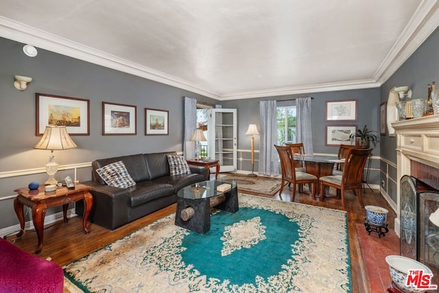 living room with ornamental molding and dark hardwood / wood-style flooring