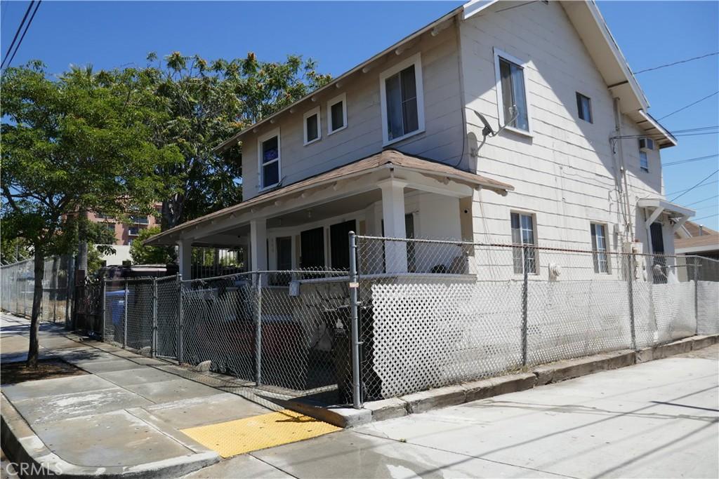 view of side of property with covered porch