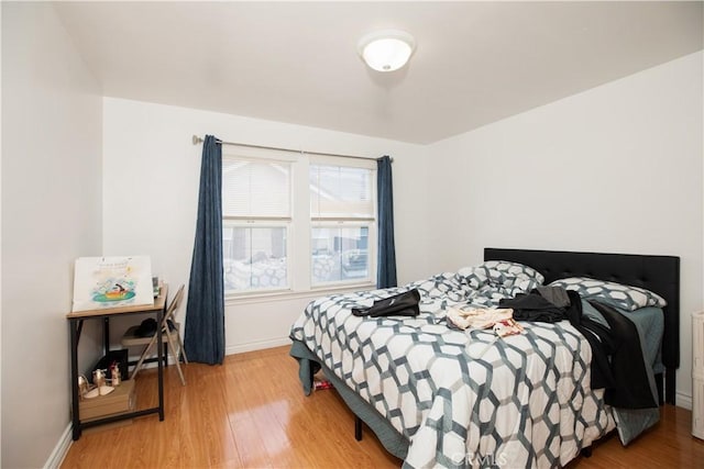 bedroom with hardwood / wood-style flooring