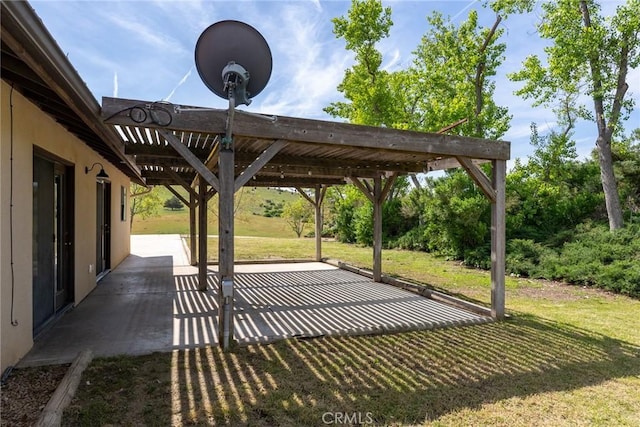 view of home's community with a pergola, a patio area, and a lawn