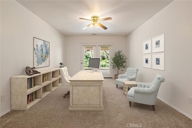 office featuring ceiling fan and light carpet