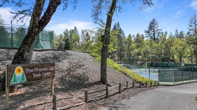 exterior space with tennis court