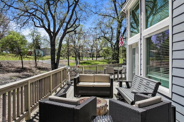 wooden deck with an outdoor hangout area