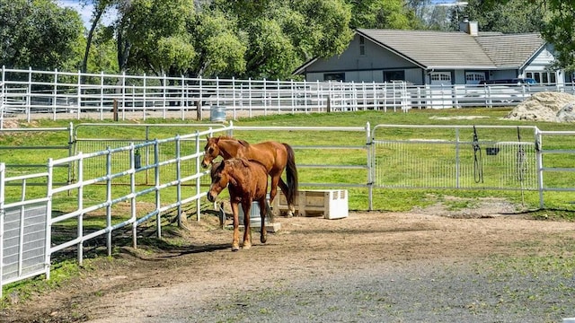 view of stable featuring a rural view