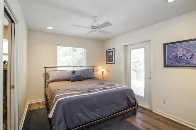 bedroom with ceiling fan, access to exterior, and dark hardwood / wood-style floors