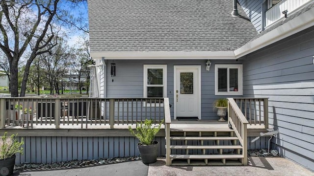 view of exterior entry featuring a deck