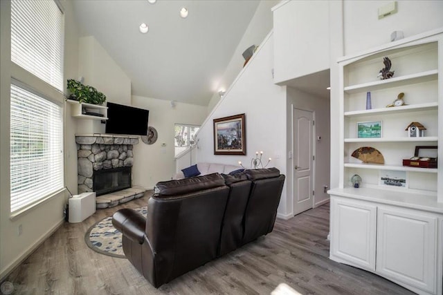 living room featuring light hardwood / wood-style floors and a fireplace