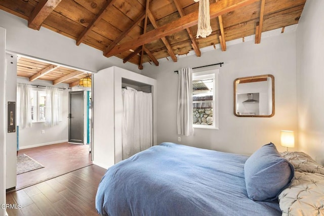 bedroom with dark hardwood / wood-style flooring, lofted ceiling with beams, multiple windows, and wooden ceiling