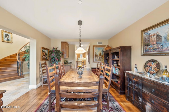 dining room with hardwood / wood-style flooring