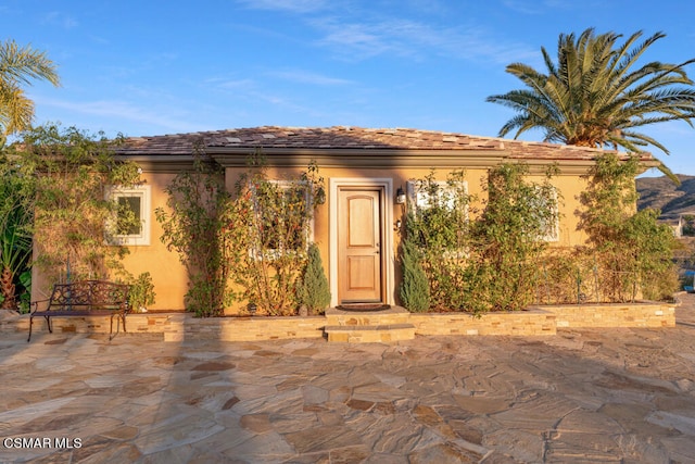 view of front of property with a patio