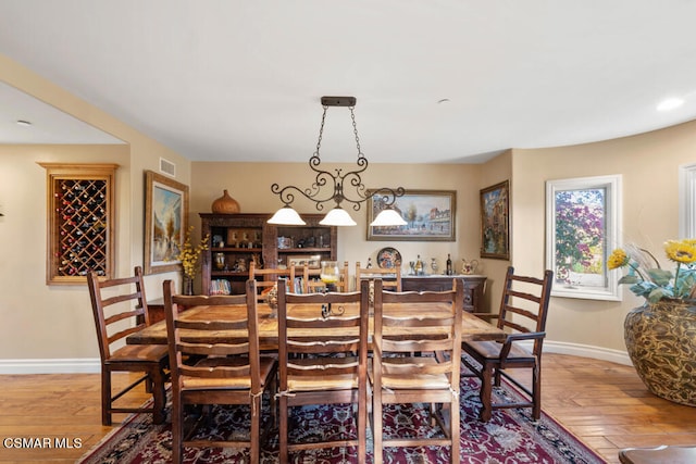 dining area featuring wood-type flooring