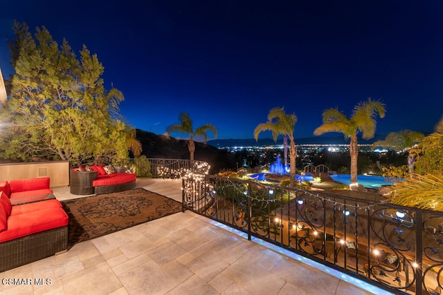 patio at twilight with an outdoor hangout area